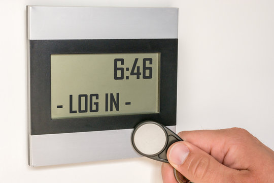 Digital Time Recording With A Modern Time Clock And An Employee's Chip