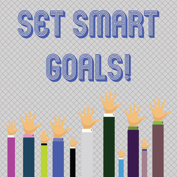 Text sign showing Set Smart Goals. Business photo showcasing list to clarify your ideas focus efforts use time wisely Hands of Several Businessmen Raising Up Above the Head, Palm Facing Front