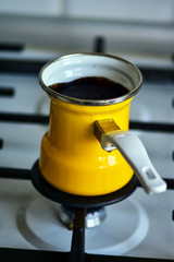 Close-up Turkish Coffee pot on a gas stove breakfast in the early morning