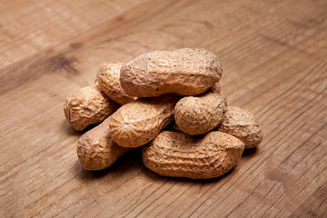 Peanut on wooden table.Healthy food and snack.