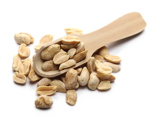 Dry roasted peanuts with wooden spoon isolated on white background