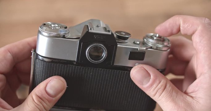 An old Zenit-E film SLR camera with an interchangeable Helios 44-2. Price 100 rubles. USSR. Leningrad. 1980