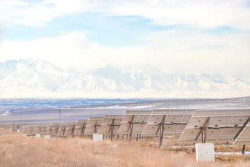 Solar Power Station with mountains. Solar Energy in Kazakhstan