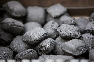 Fototapeta na wymiar Charcoal briquettes for grill