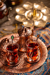 Obraz na płótnie Canvas Turkish tea in traditional glasses