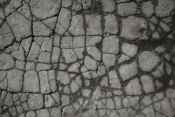 asphalt in cracks texture / abstract background cracks on asphalt road