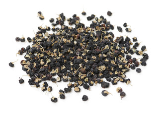Traditional Chinese black herbs dried wolfberry on white background