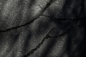 asphalt in cracks texture / abstract background cracks on asphalt road