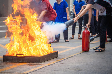 Employees firefighting training,Extinguish a fire.