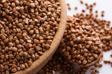 Grain buckwheat on a white acrylic background