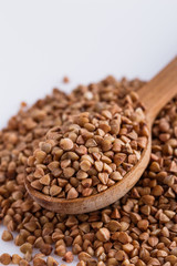 Grain buckwheat on a white acrylic background
