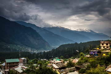 Aerial view of Mountain Village and in background Beautiful panoramic view of Mountain range in Manali, Himachal Pradesh. India.