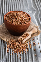 Grain buckwheat on a gray wooden background