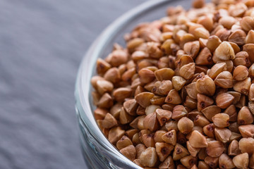 Grain buckwheat on a dark stone background