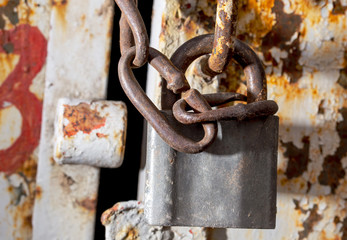 Lock on a rusty metal garage