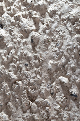 Wall of sand and concrete as an abstract background