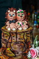 Decoration of happy baby hedgehogs cake
