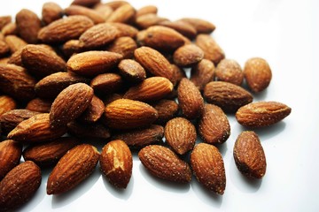 Almond tablets mixed  with salt on white isolated.