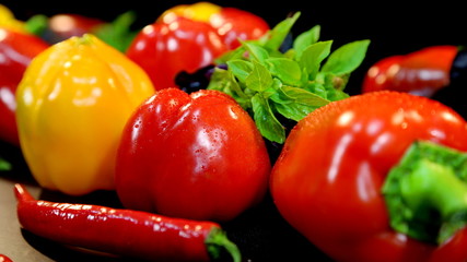 Dew drops on red and yellow pepper
