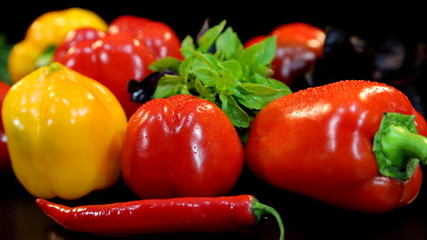 Vegetables. Fresh red and yellow pepper with green herbs
