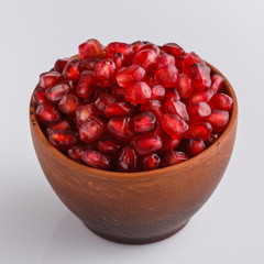 grains of a grenade on a white acrylic background