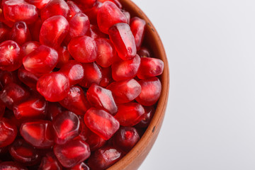 grains of a grenade on a white acrylic background