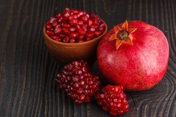 grains of a grenade on a dark rustic background