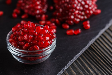 grains of a grenade on a dark rustic background
