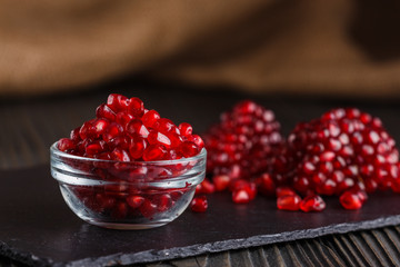grains of a grenade on a dark rustic background