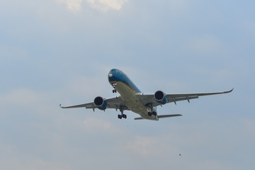 Fototapeta na wymiar Airplane landing at Saigon Airport (SGN)