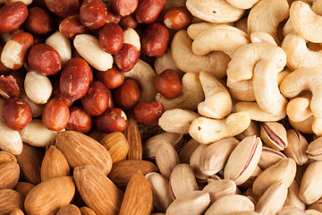 mix of nuts on a wooden table