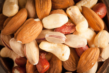 mix of nuts on a wooden table