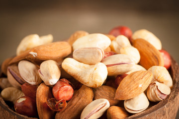 mix of nuts on a wooden table