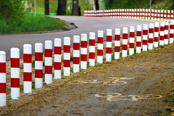 Striped red and white roadside safety posts