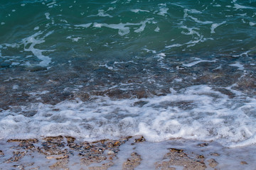 The waves of the sea are entering the sand.Summer,holiday. Blurred and soft focus.