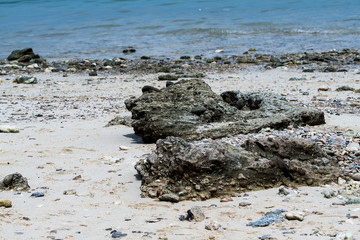 Rocks on the beach.stone and white sand.Blurred and soft focus.