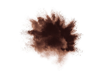 Abstract brown powder explosion on white background.