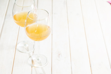 Orange wine in glasses. Food trend. Rustic background
