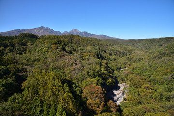 Mountains with red leaves and blue sky