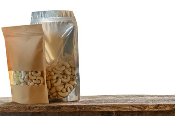 Cashew nuts  packaging bag on  floor wooden old with a white background