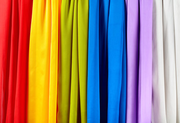 Vertical colorful satin curtains.