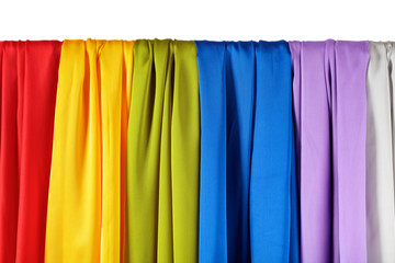 Vertical colorful satin curtains isolated on white.