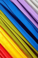 Vertical colorful satin curtains.