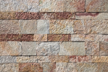Background, texture, laying of red and yellow natural stone.