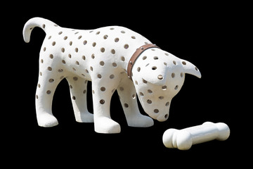 the white dog has a hole in the body that is looking at the white bone