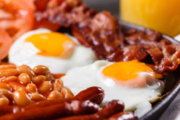 delicious English breakfast on a dark rustic background