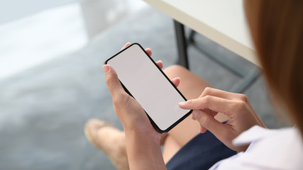 Top view female using and touching mobile smartphone