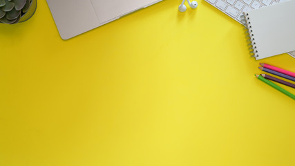 Minimal workspace and office supplies on pastel top table background