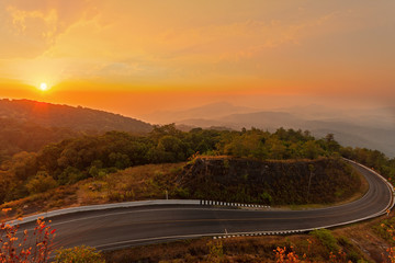 Doi Inthanon with the mist on the morning sun. Scenic view of Doi Inthanon National Park in Chom Thong District, Chiang Mai Province, Northern Thailand. The roof of Thailand.