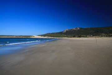 Lonely wide beach in the morning during low tide - Zahara delos Atunes at Costa de la Luz, Spain